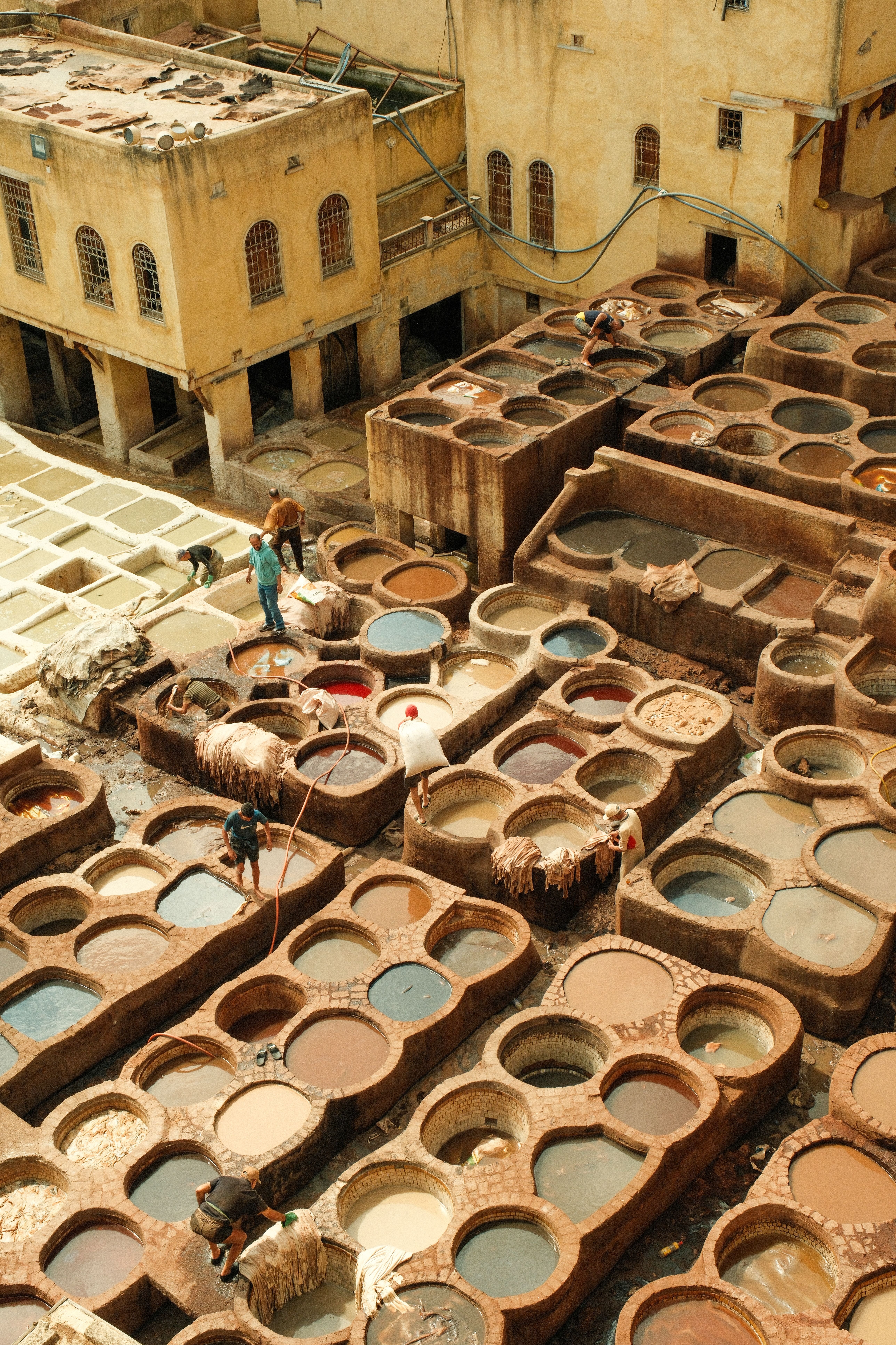 The Chouara tannery in Fez viewed from a leather-shop terrace, dye pits below
