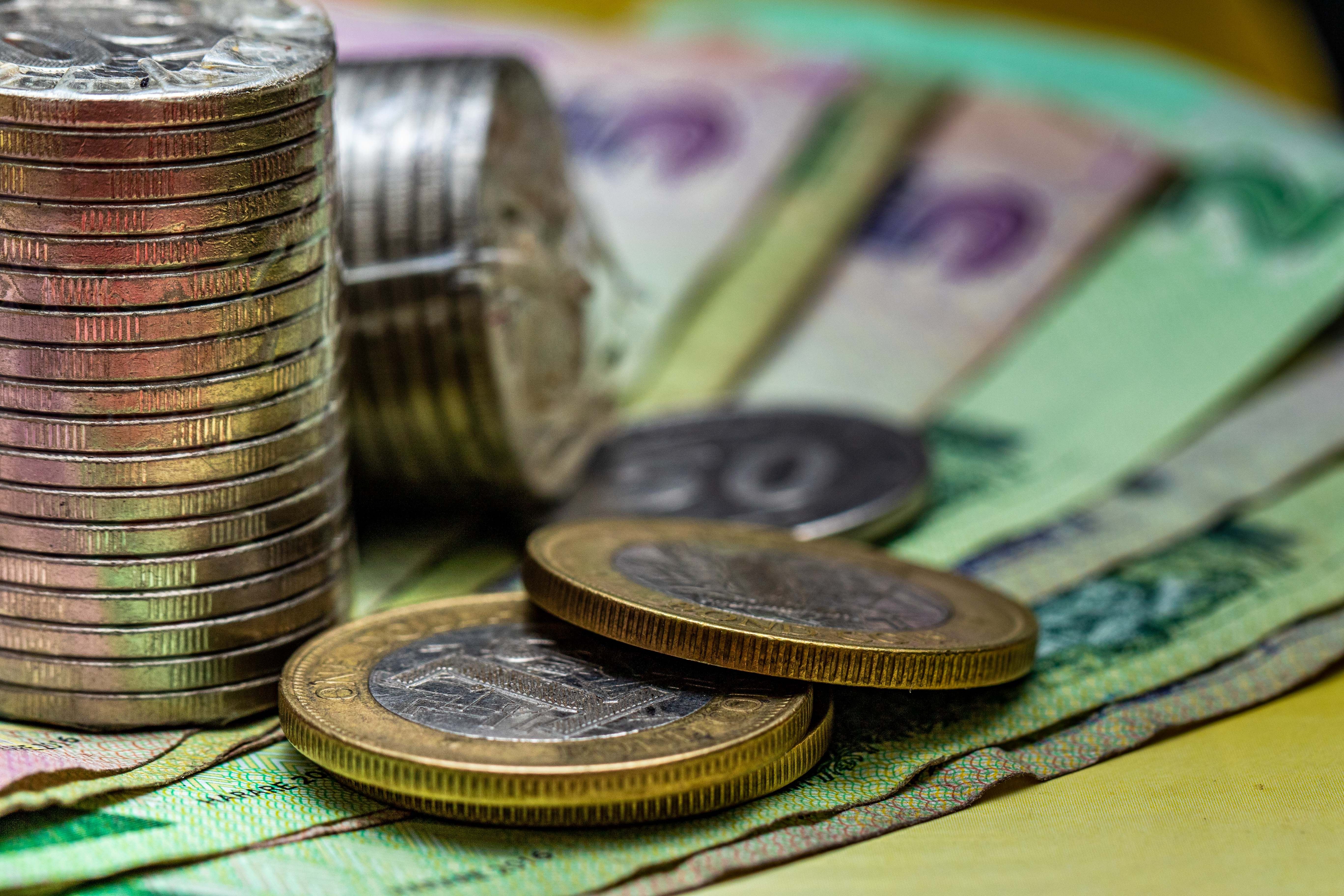 Colorful Moroccan dirham banknotes and coins fanned out on a table
