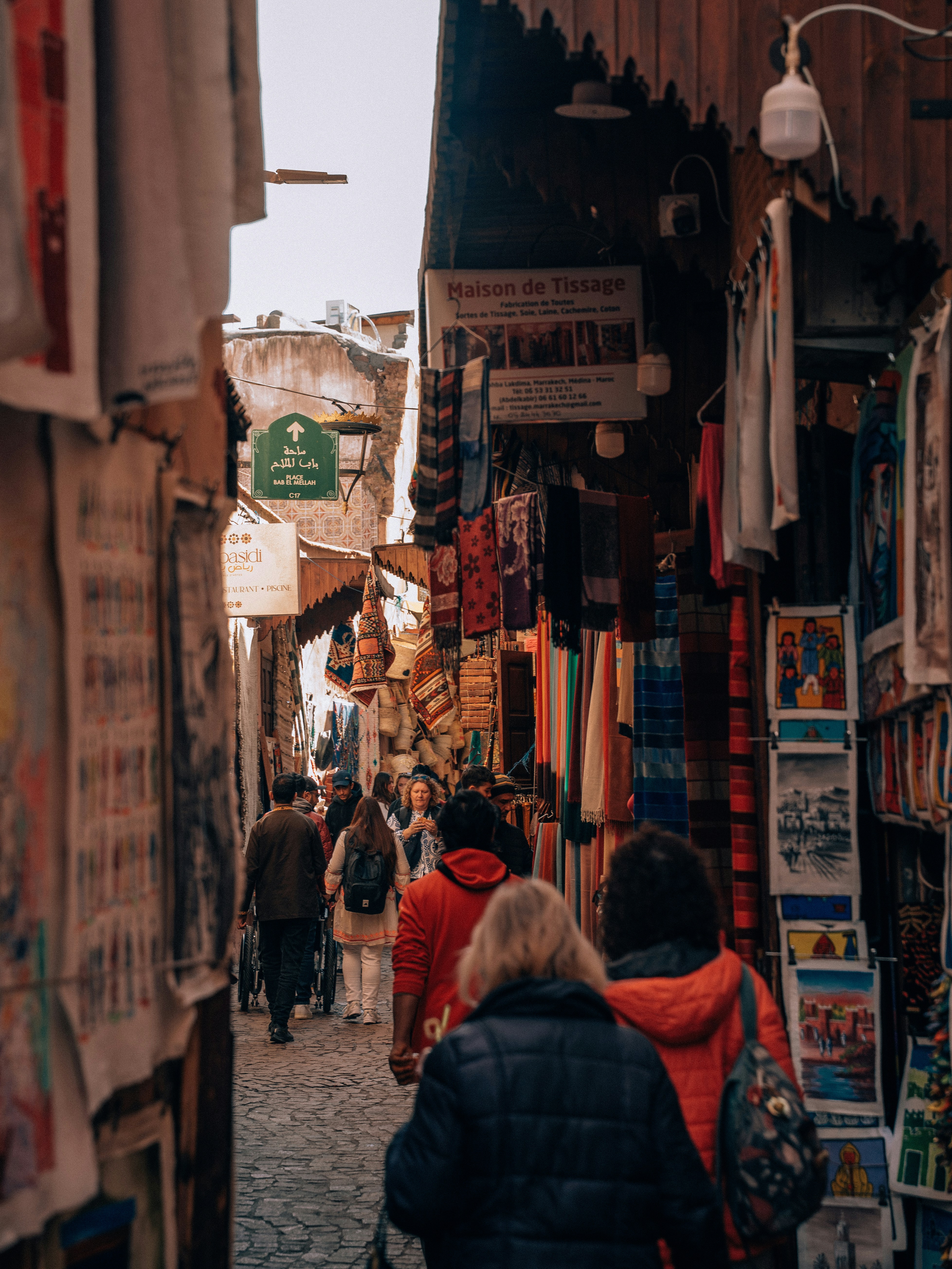 A small group with a local guide walking through a Moroccan medina