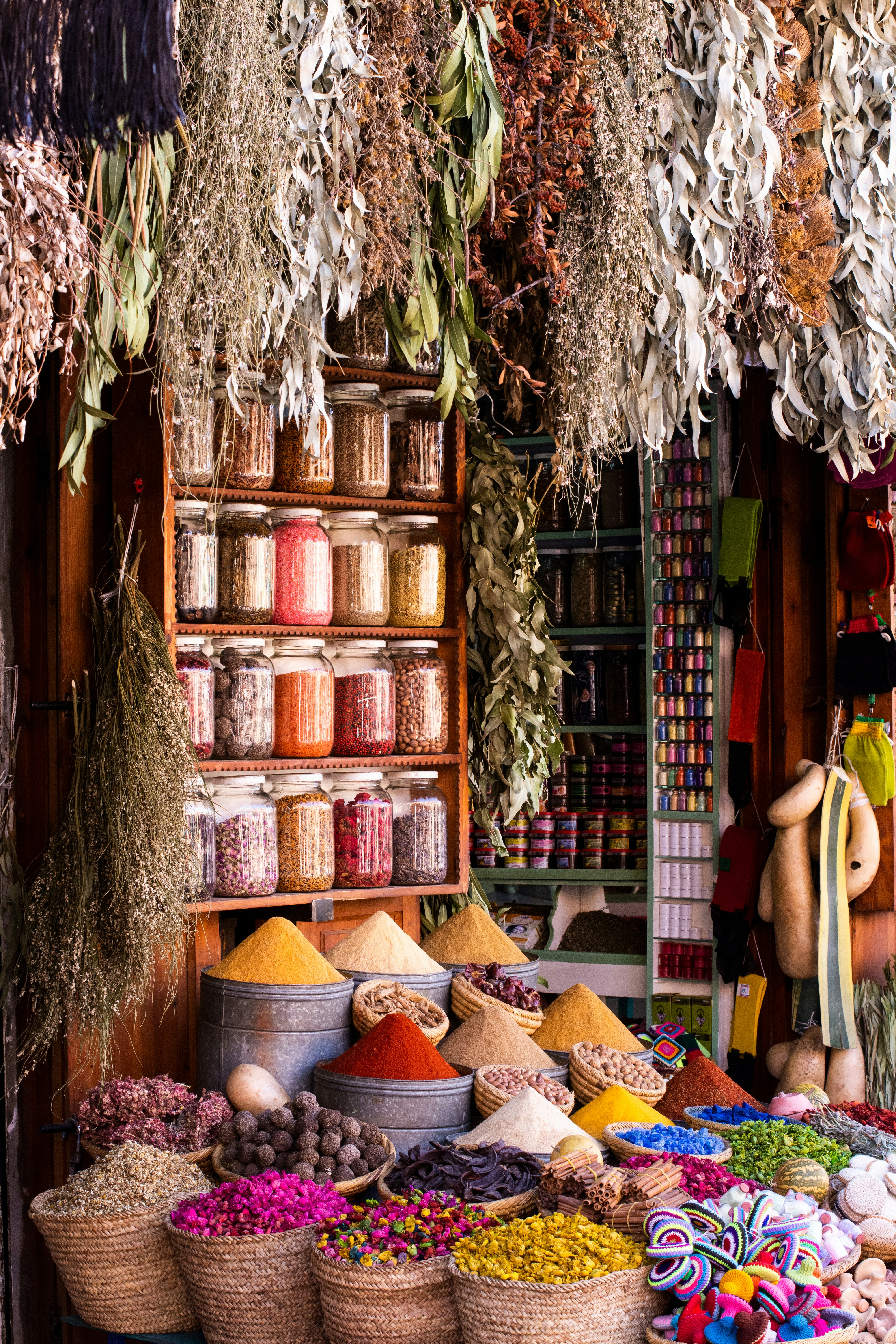 Colorful spices and lanterns displayed in a Marrakech souk