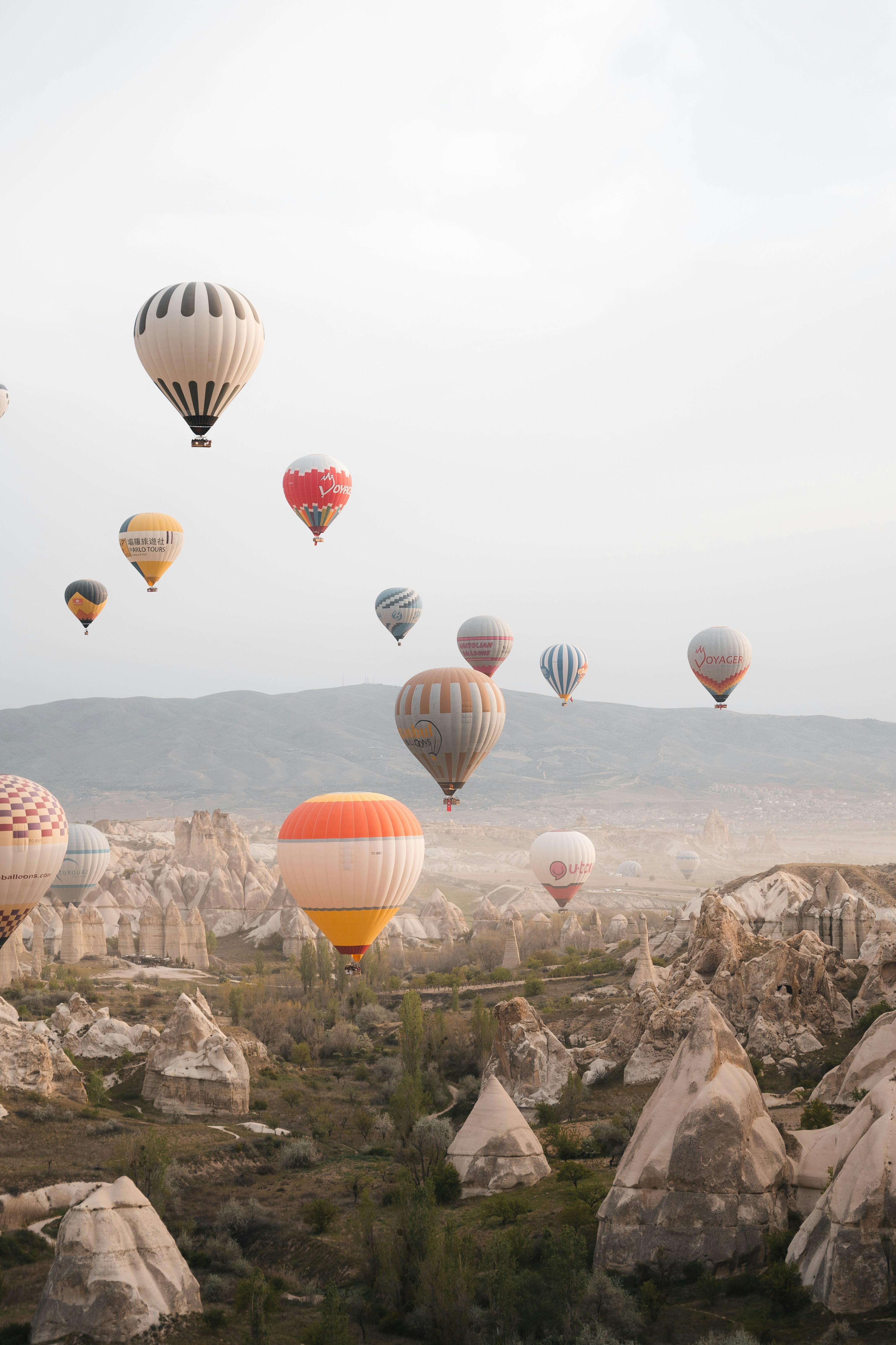 Hot air balloons over Cappadocia on a clear shoulder-season morning
