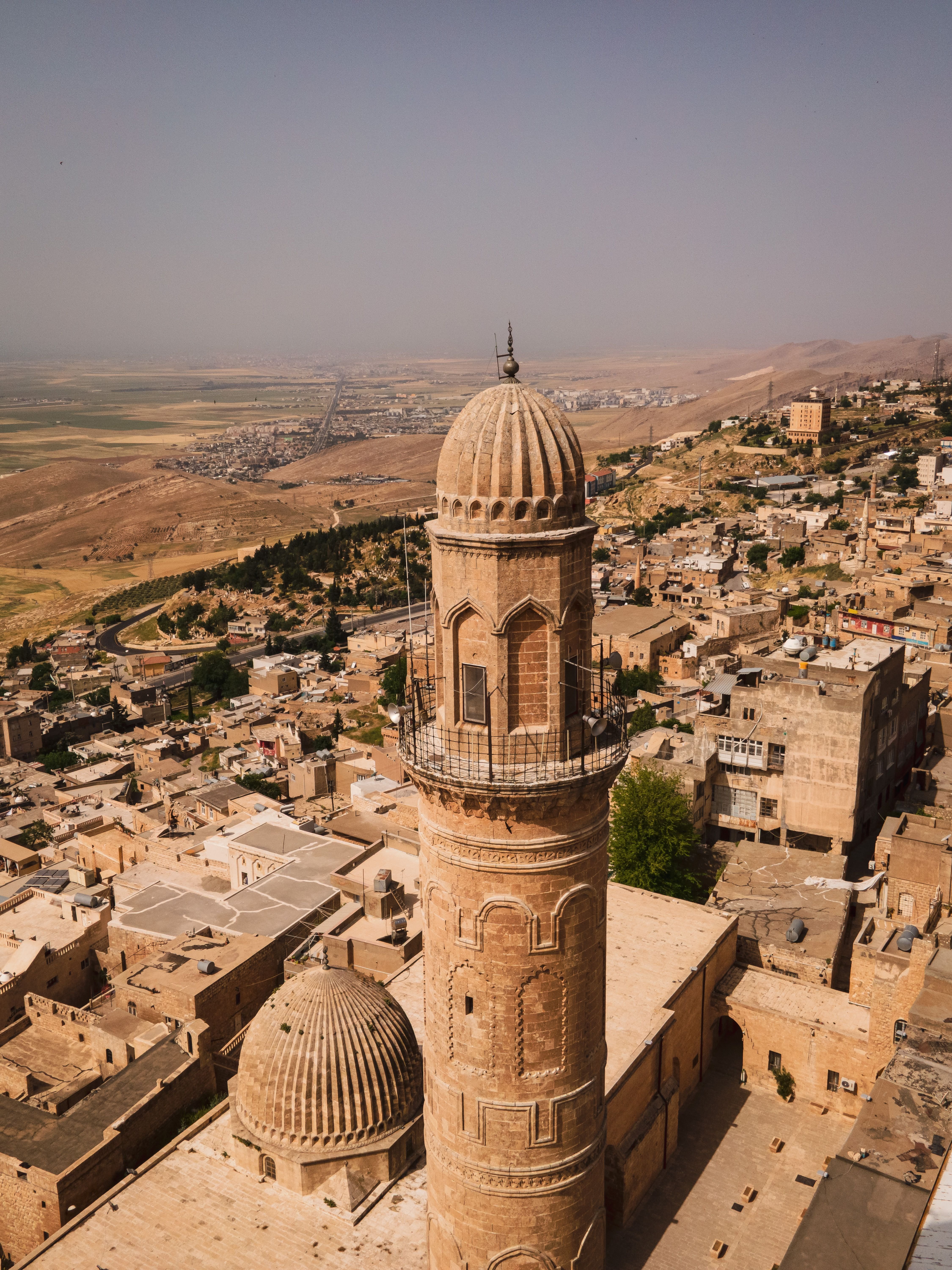 A dramatic Eastern Turkey landscape — mountains or a historic site at golden hour, no recognizable faces