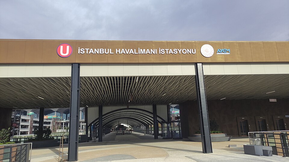 Modern interior of Istanbul Airport arrivals with transport signage