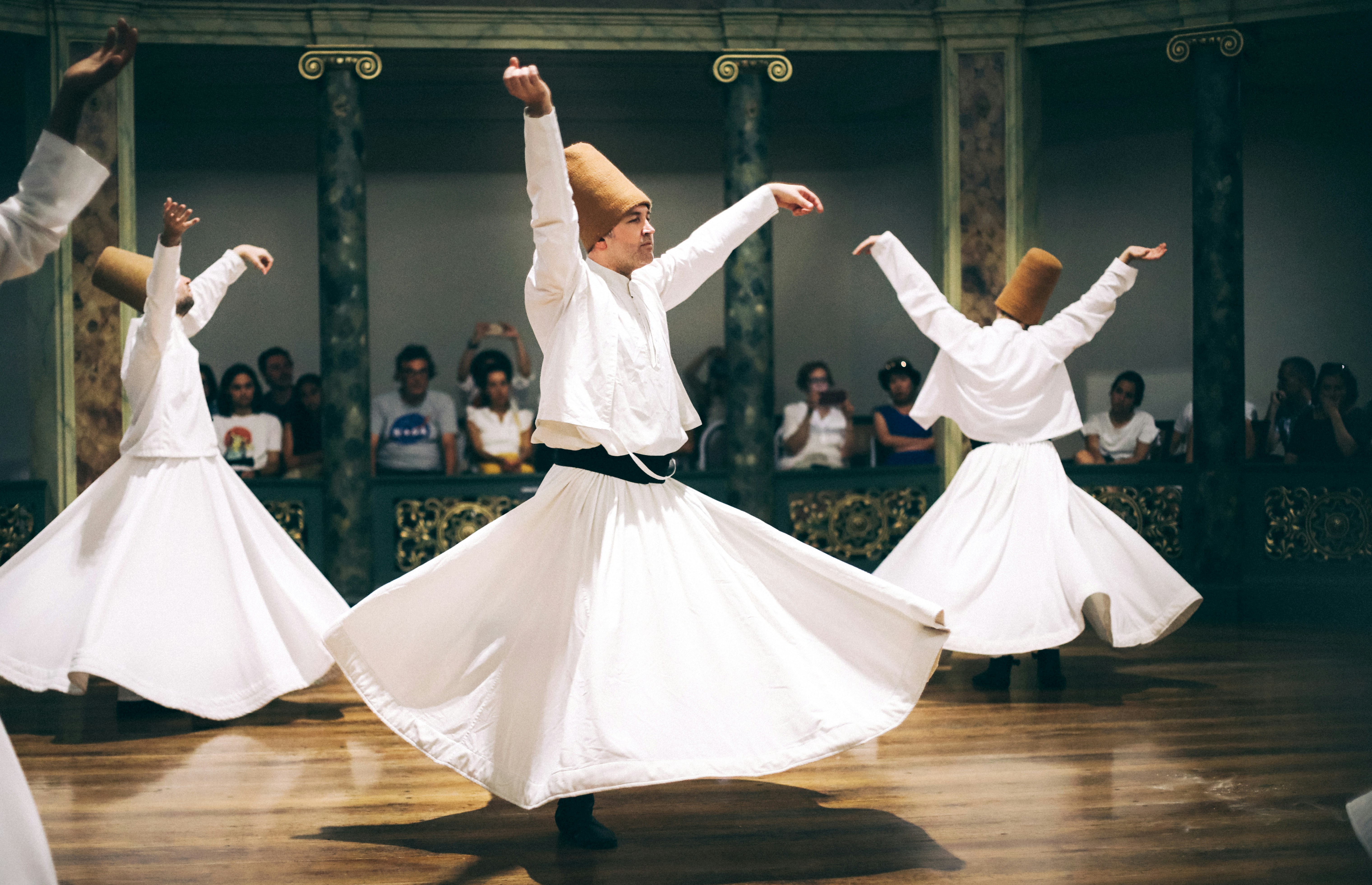 The turquoise fluted dome of the Mevlana Museum (Rumi's shrine) in Konya, no recognizable faces