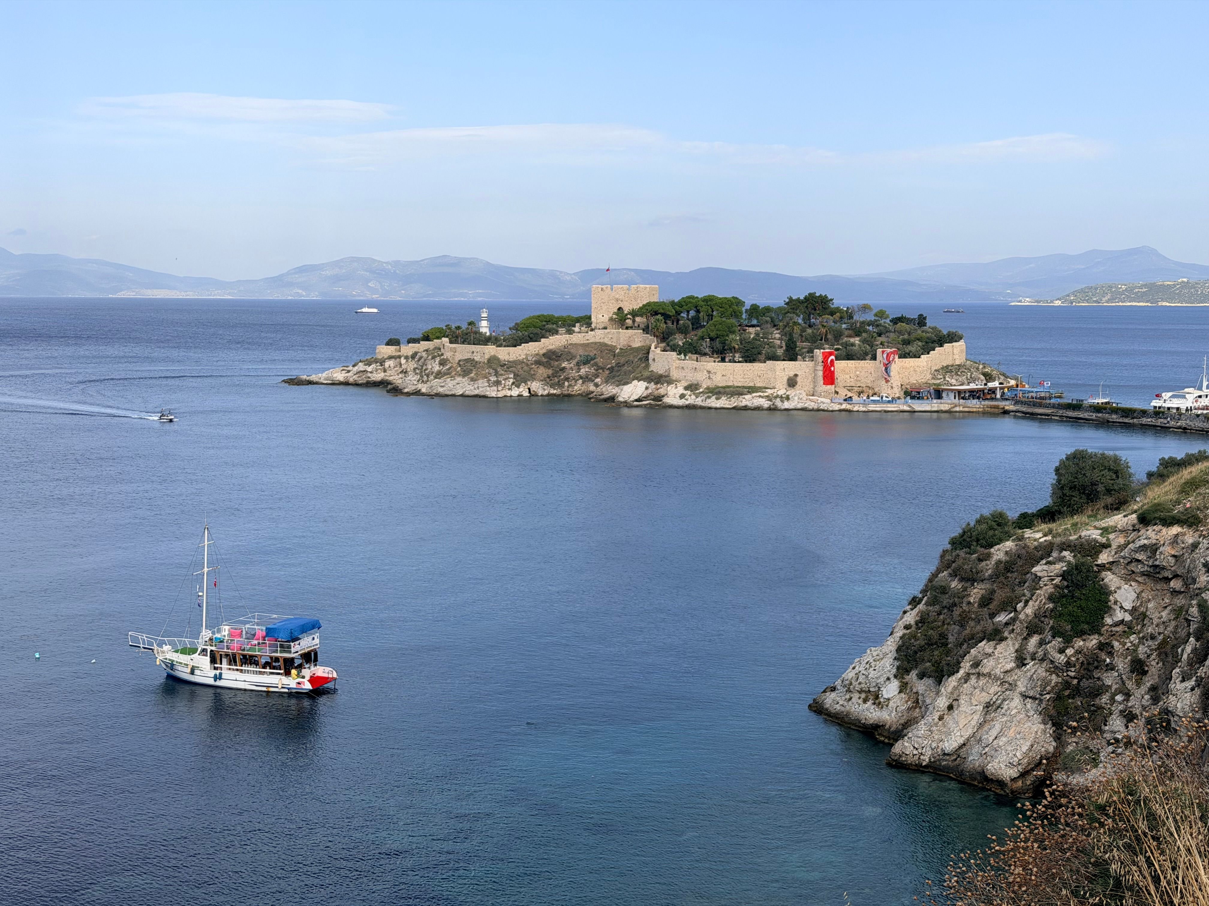 Kusadasi harbor with cruise ships and the marina, Pigeon Island in the background, no faces