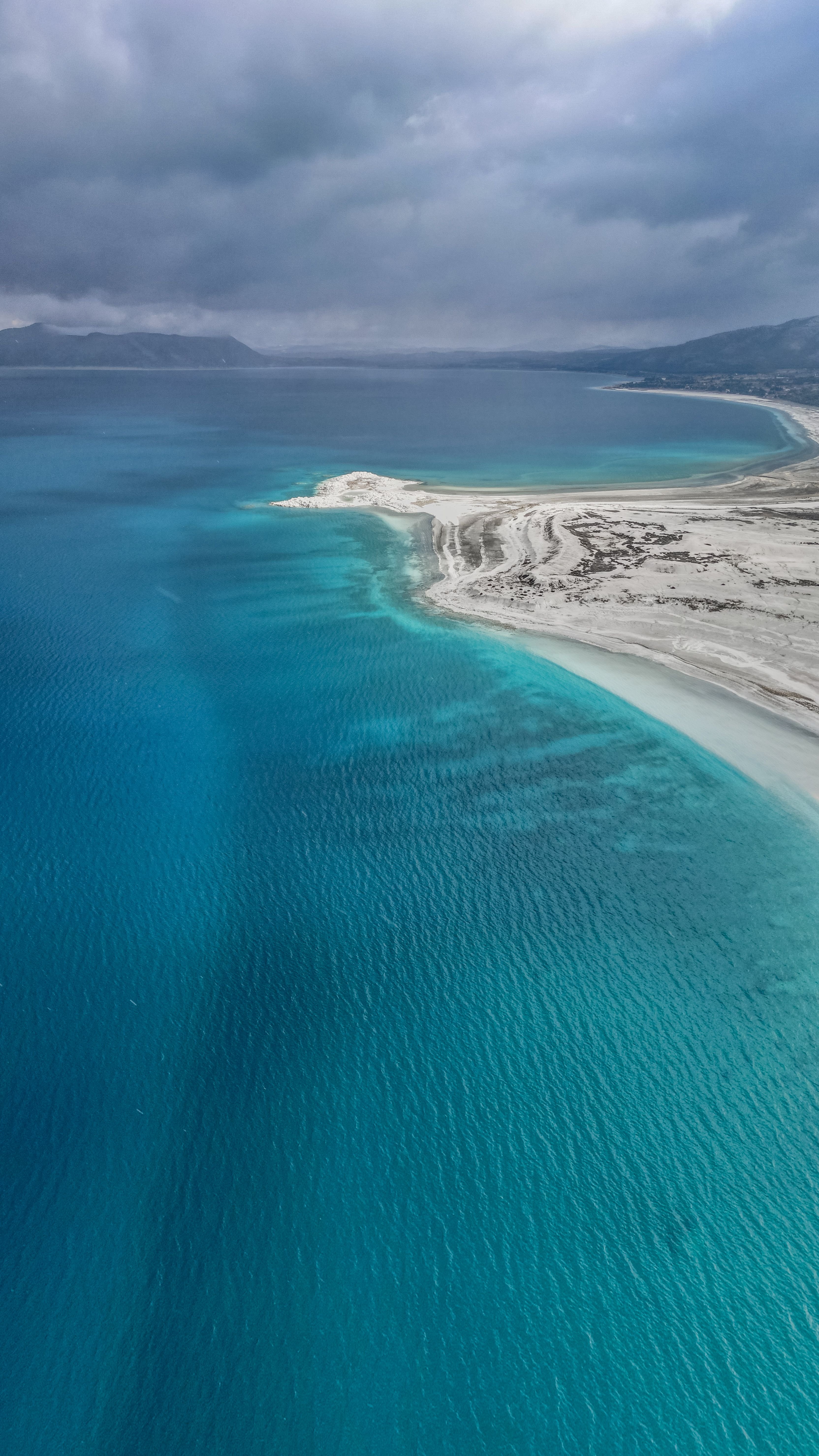 Clear turquoise shallows of Lake Salda over the pale lakebed