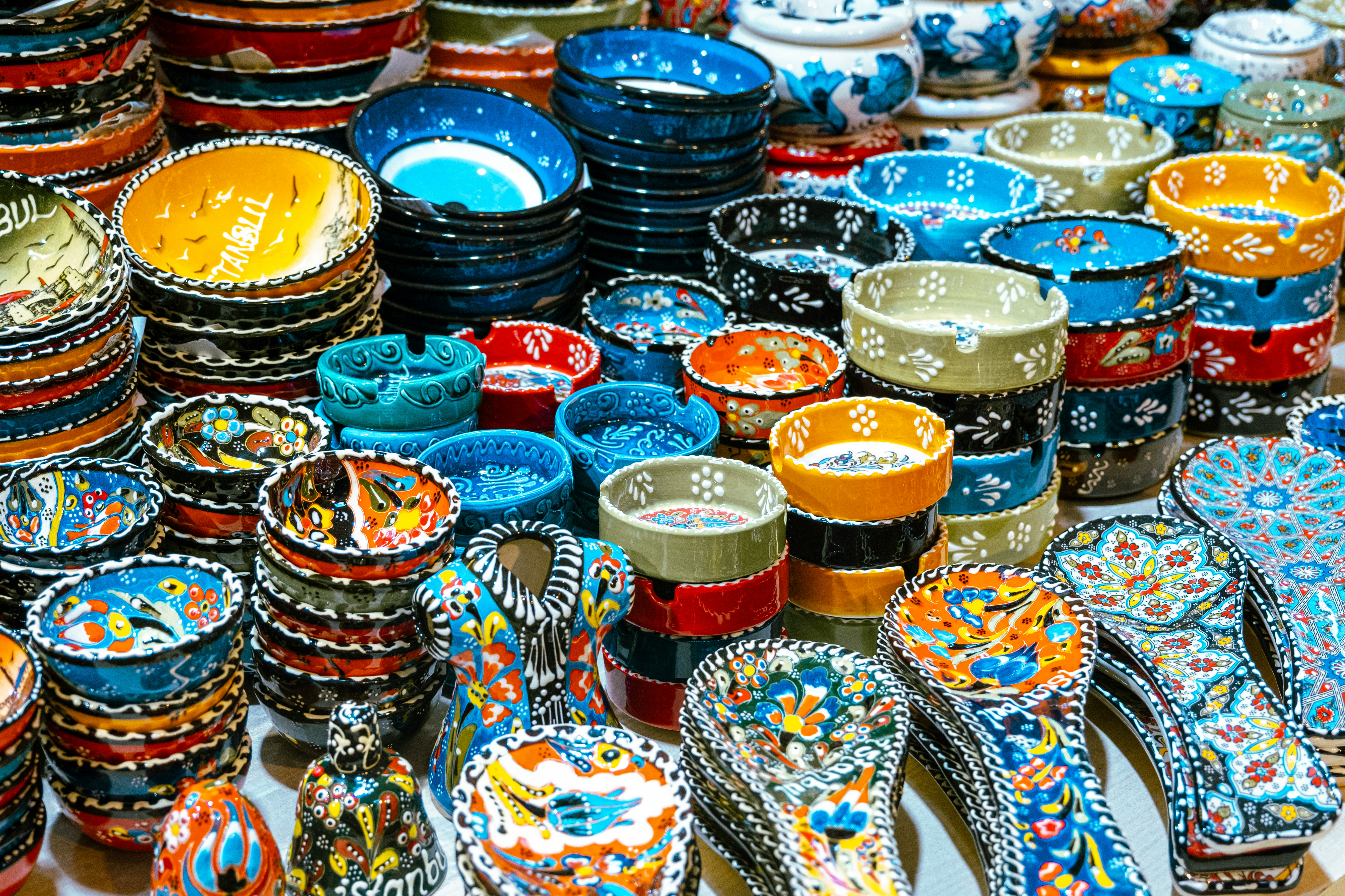 Stacks of colorful Turkish ceramics and bowls in a market stall