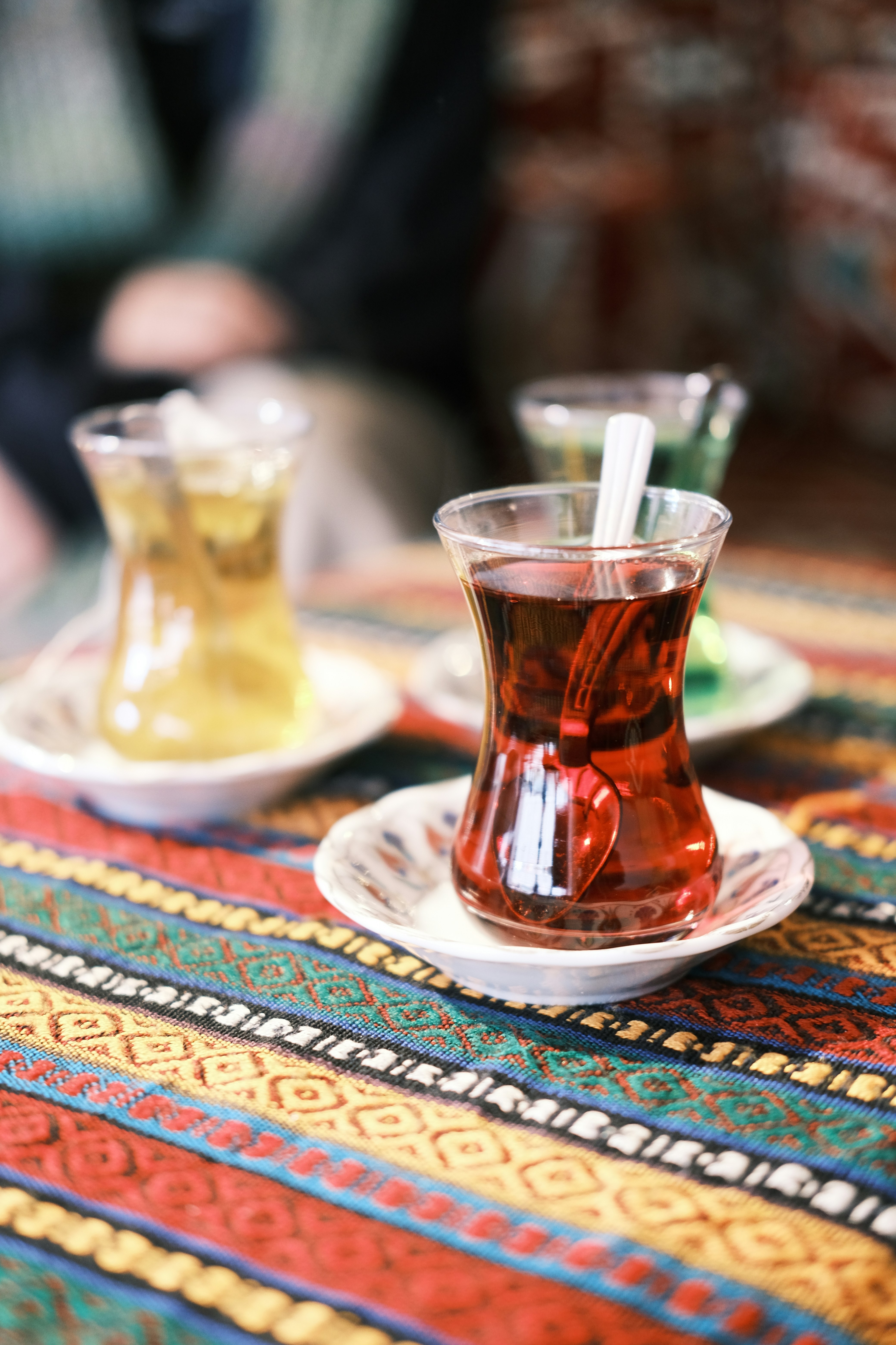 A warm scene of Turkish hospitality — tea being poured or a welcoming shopkeeper, no recognizable faces