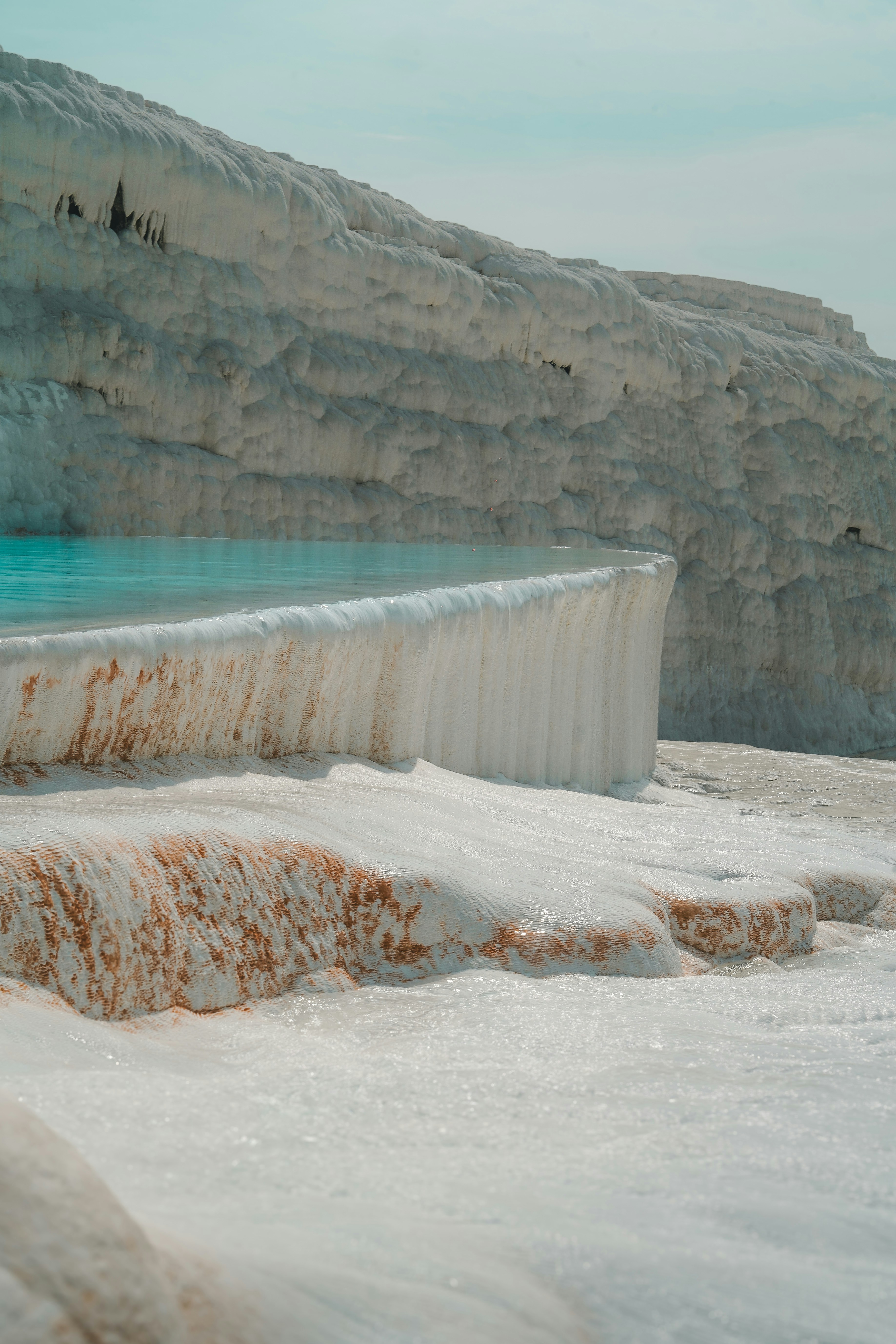 The white travertine pools of Pamukkale cascading down the hillside