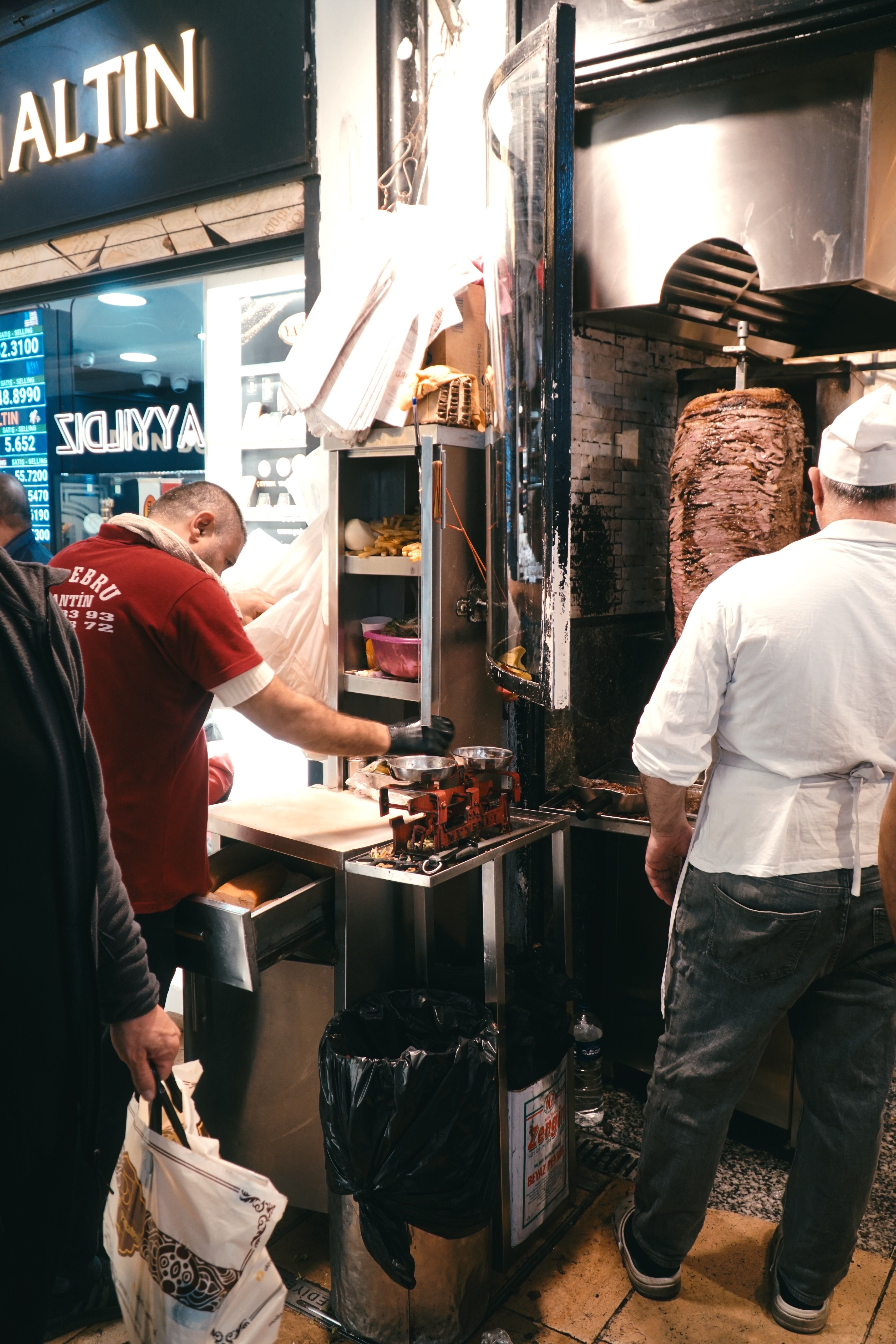 A vendor grilling balık ekmek fish sandwiches by the water in Istanbul