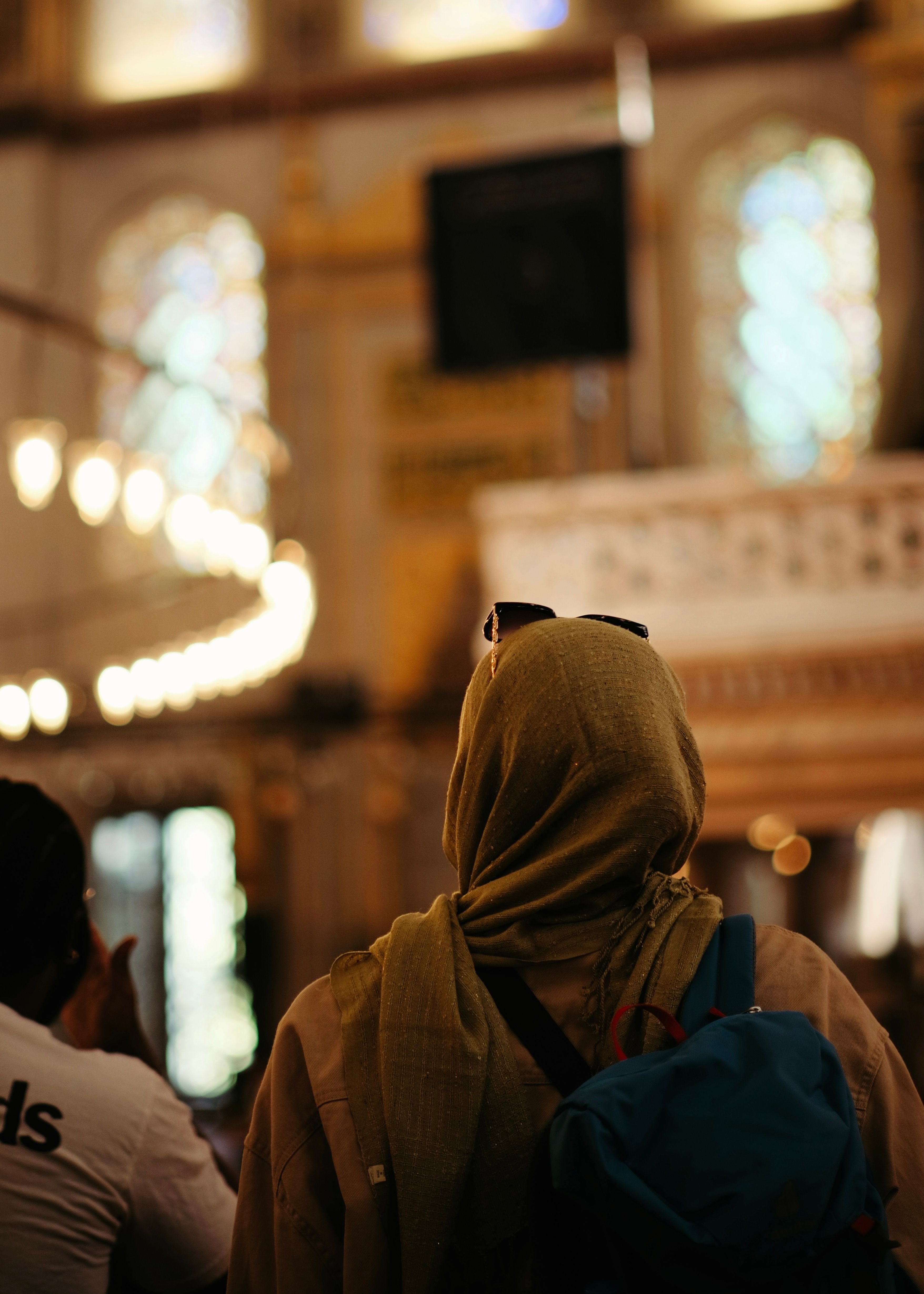 A stylishly but practically dressed traveler in an Istanbul street setting, no recognizable faces