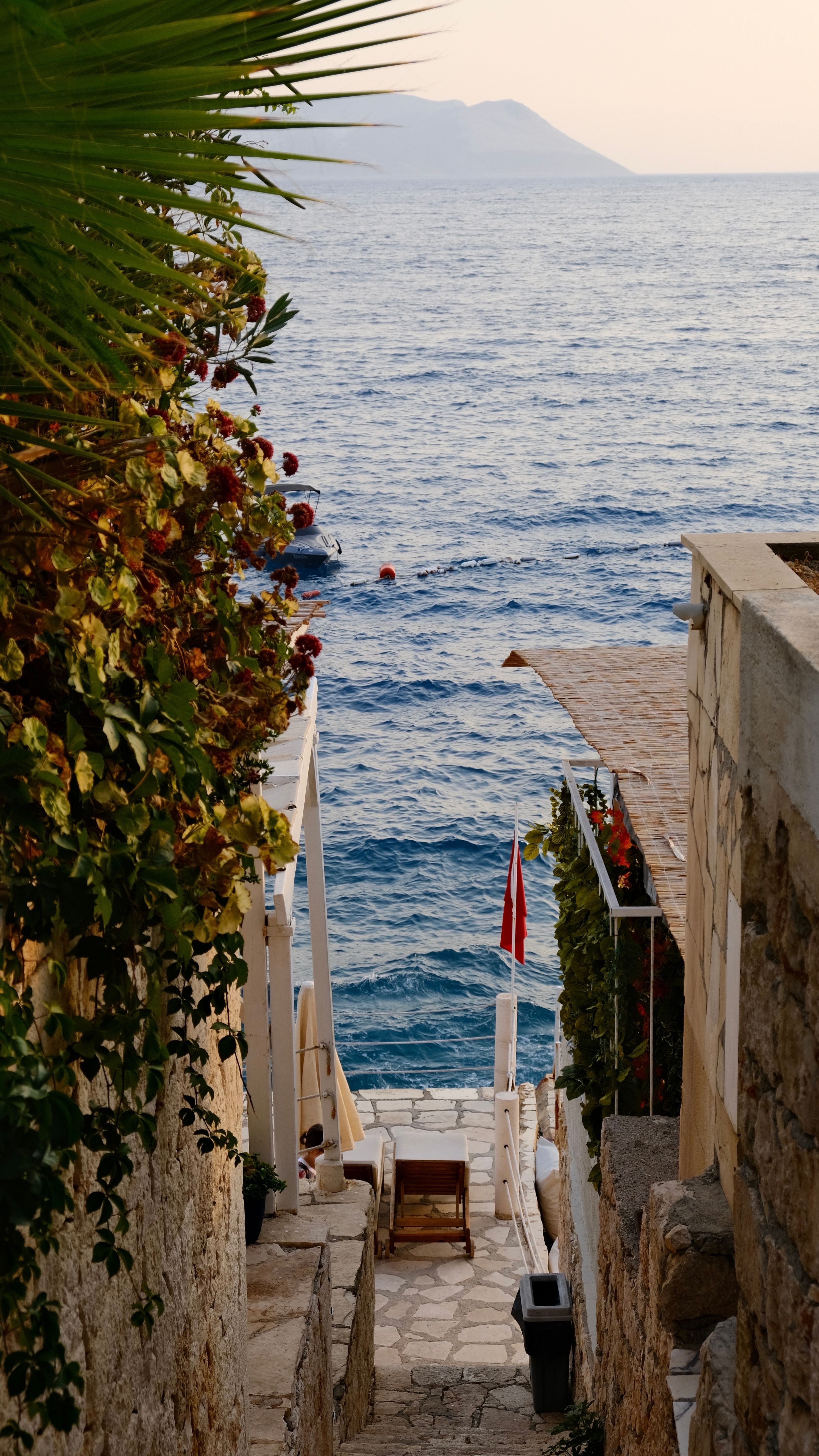 A relaxed beach-club or resort pool overlooking the Mediterranean on the Turkish Riviera